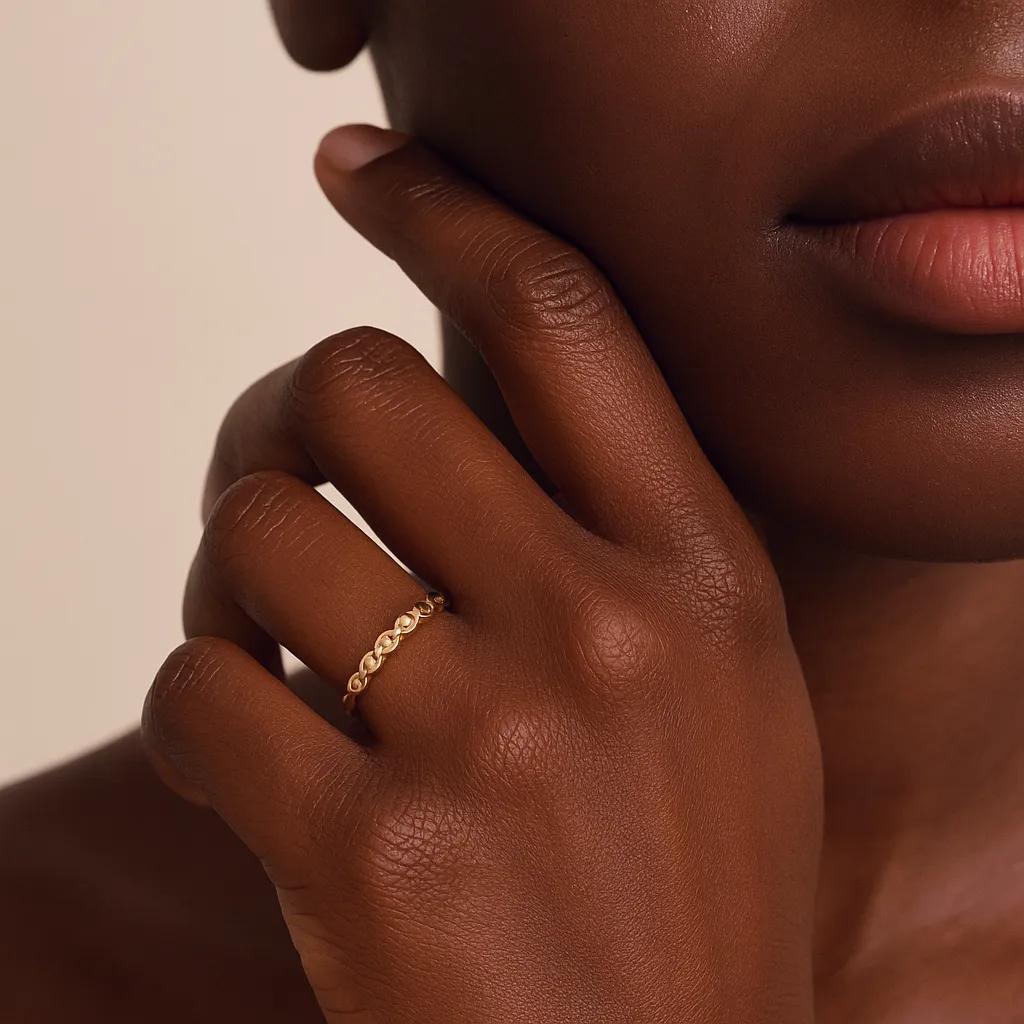 Close-up of adjustable gold ring with chain links