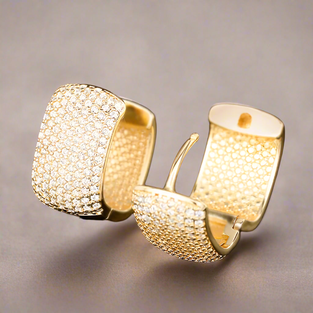 Gold-tone U-shaped earrings with brilliant CZ stones