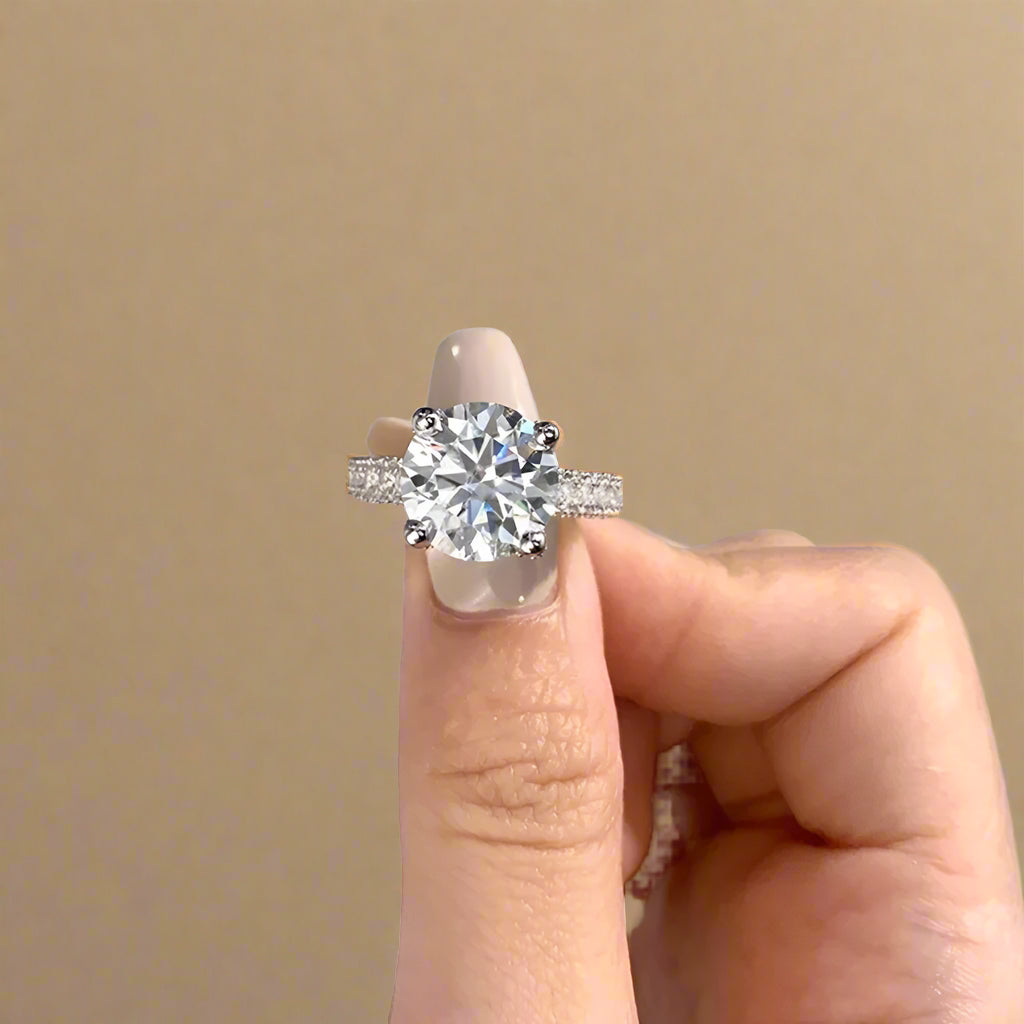 Silver ring with large solitaire stone and pave crystal setting.