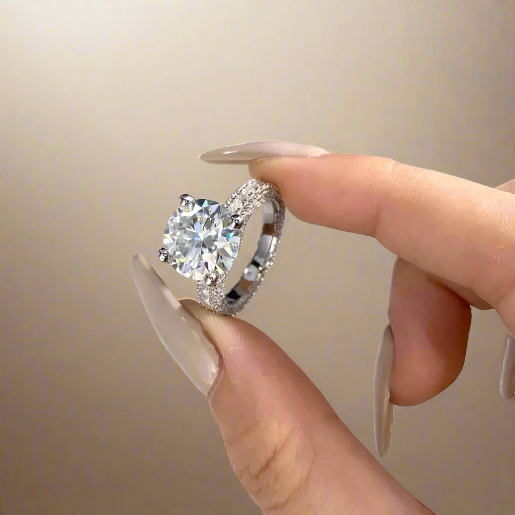  Elegant women's ring with shimmering crystals on band.
