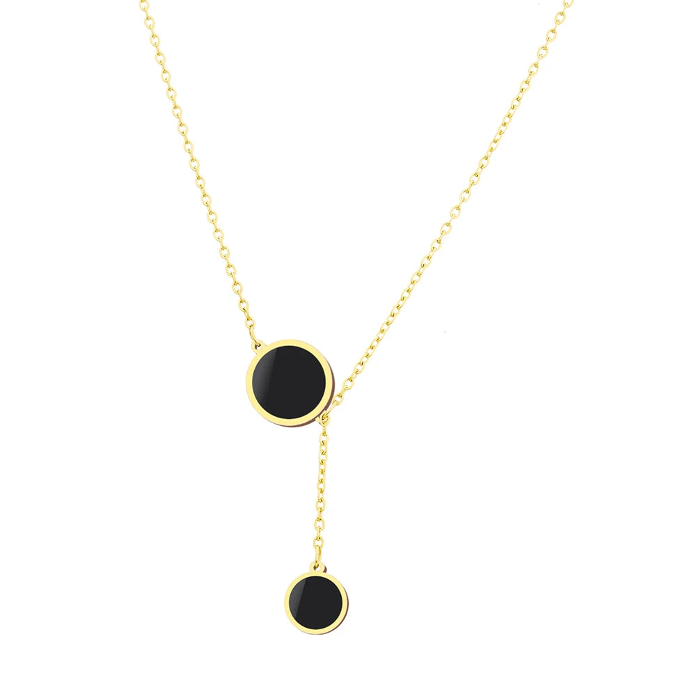 Minimalist black enamel circle pendant necklace in gold finish – flat lay