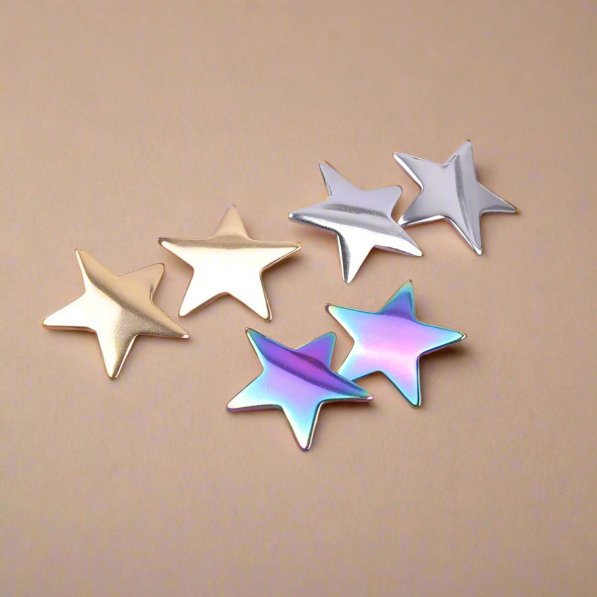 star stainless steel stud earrings in colorful and gold tones, unisex design