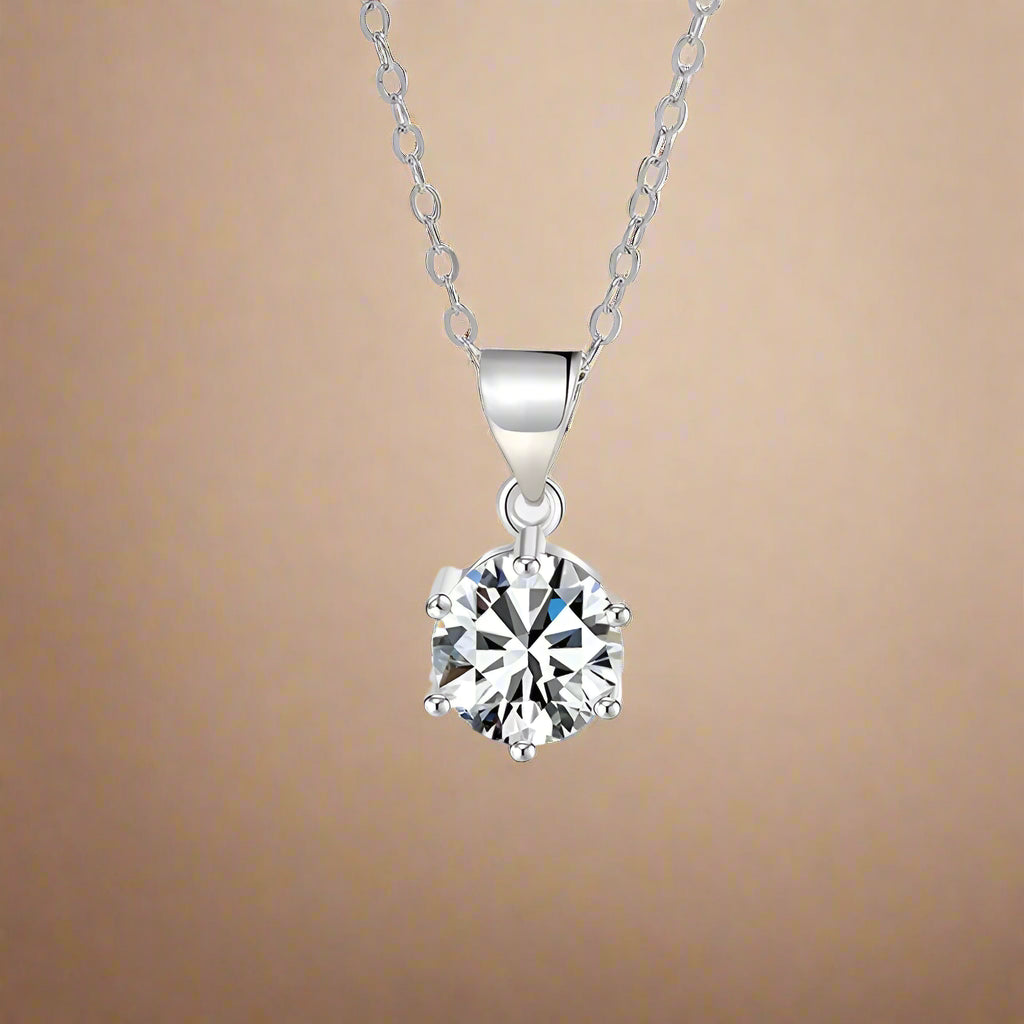 Elegant woman wearing the Lumière Moissanite Pendant Necklace, highlighting its brilliance.
