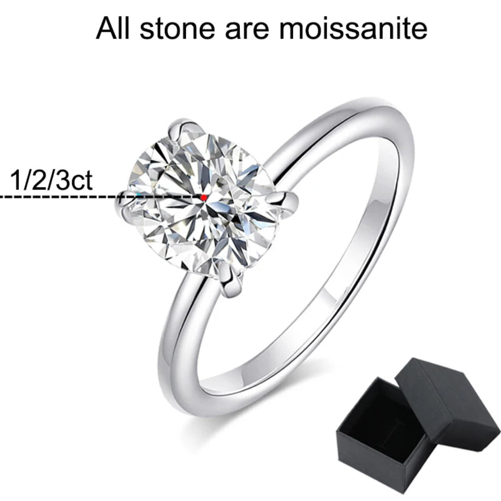  Minimalist silver ring showcasing dazzling stone centerpiece.