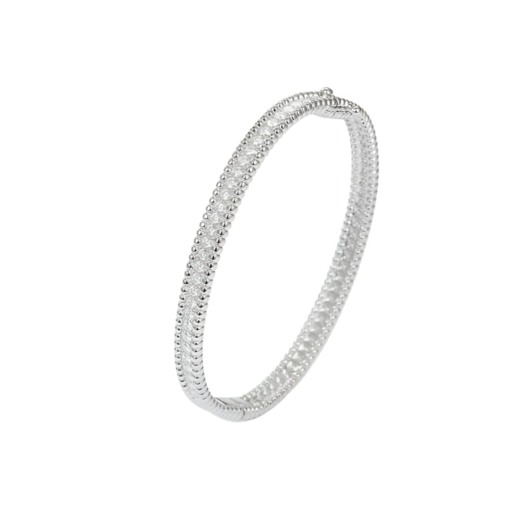 Side view highlighting the continuous row of 2mm D Color moissanite stones.