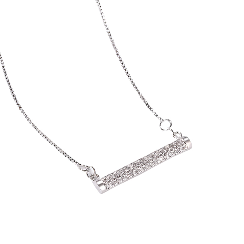 Silver necklace with a cylindrical pendant on a white background