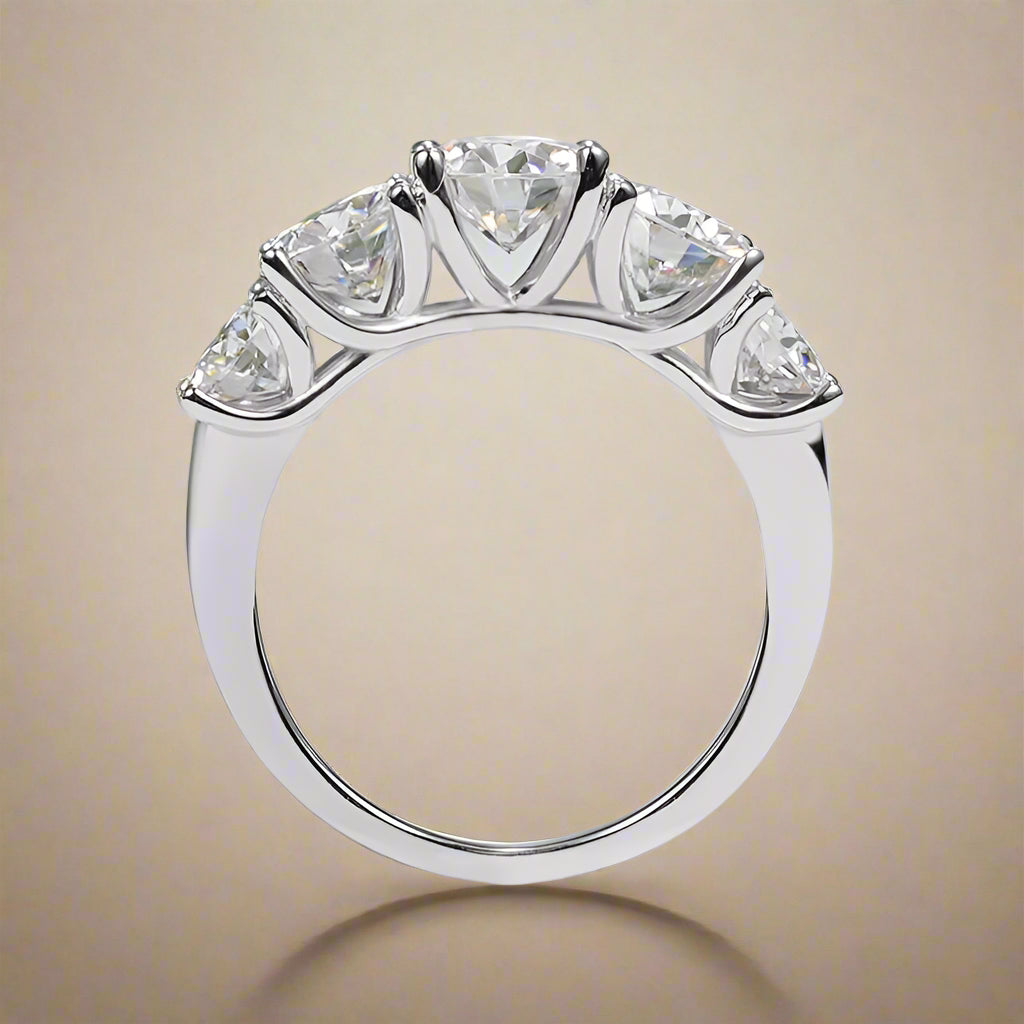 Sterling silver ring with five trillion-cut stones. 