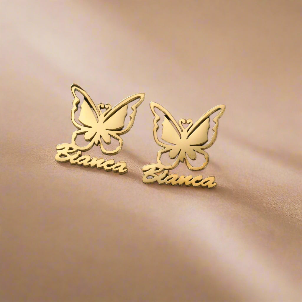 Close-up of gold-plated butterfly earrings