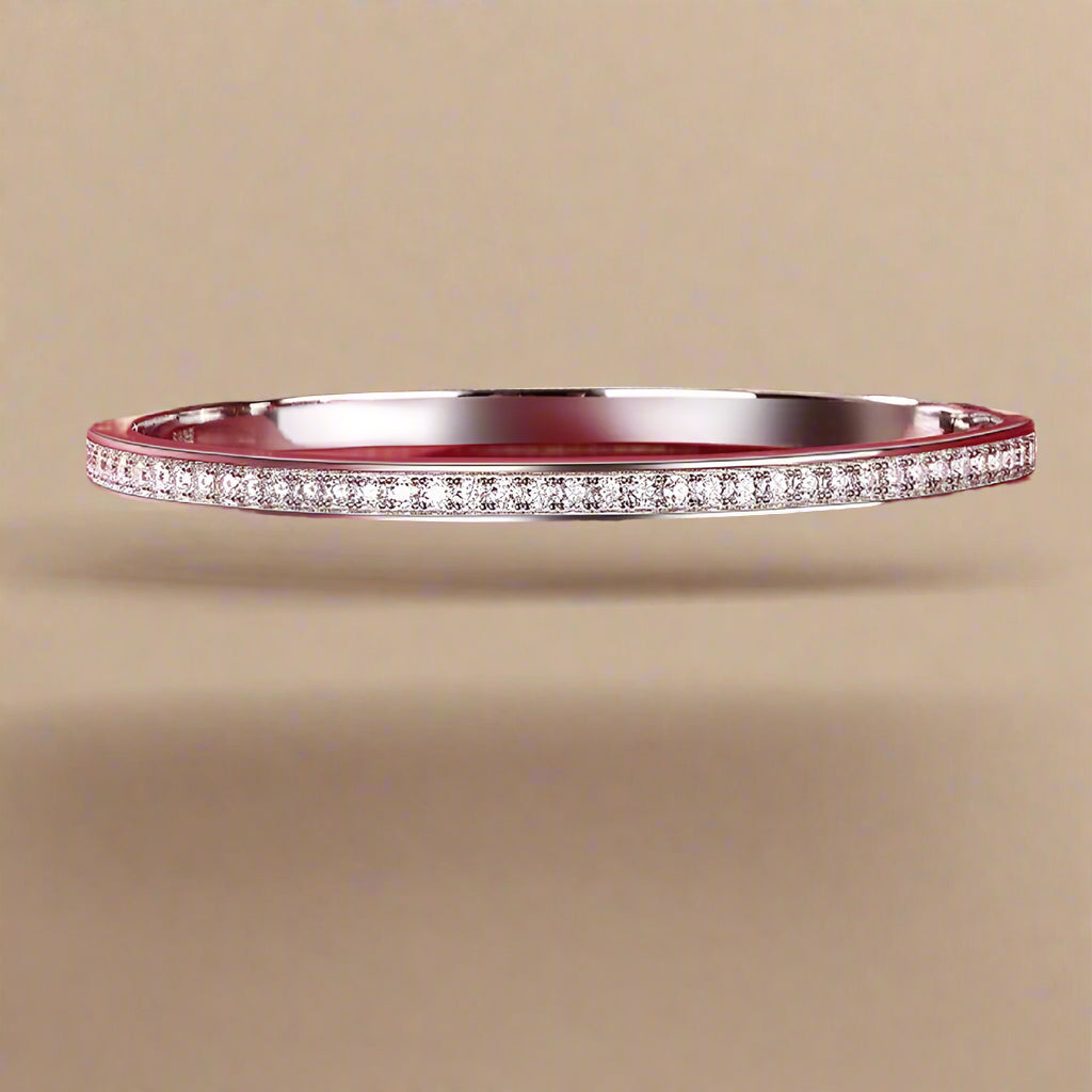 Elegant and minimalist silver bangle bracelet with subtle sparkle