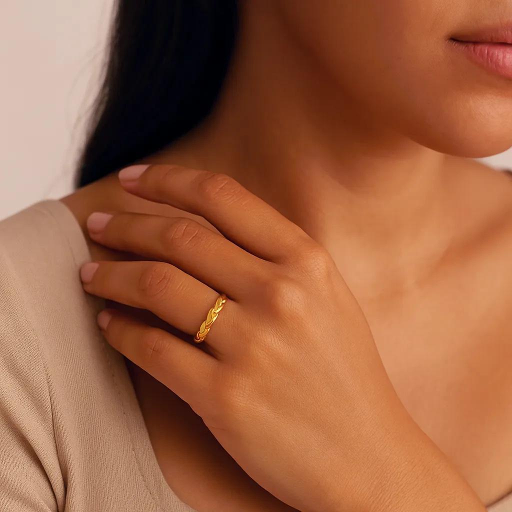 Close-up of open ring with elegant braid detailing.  