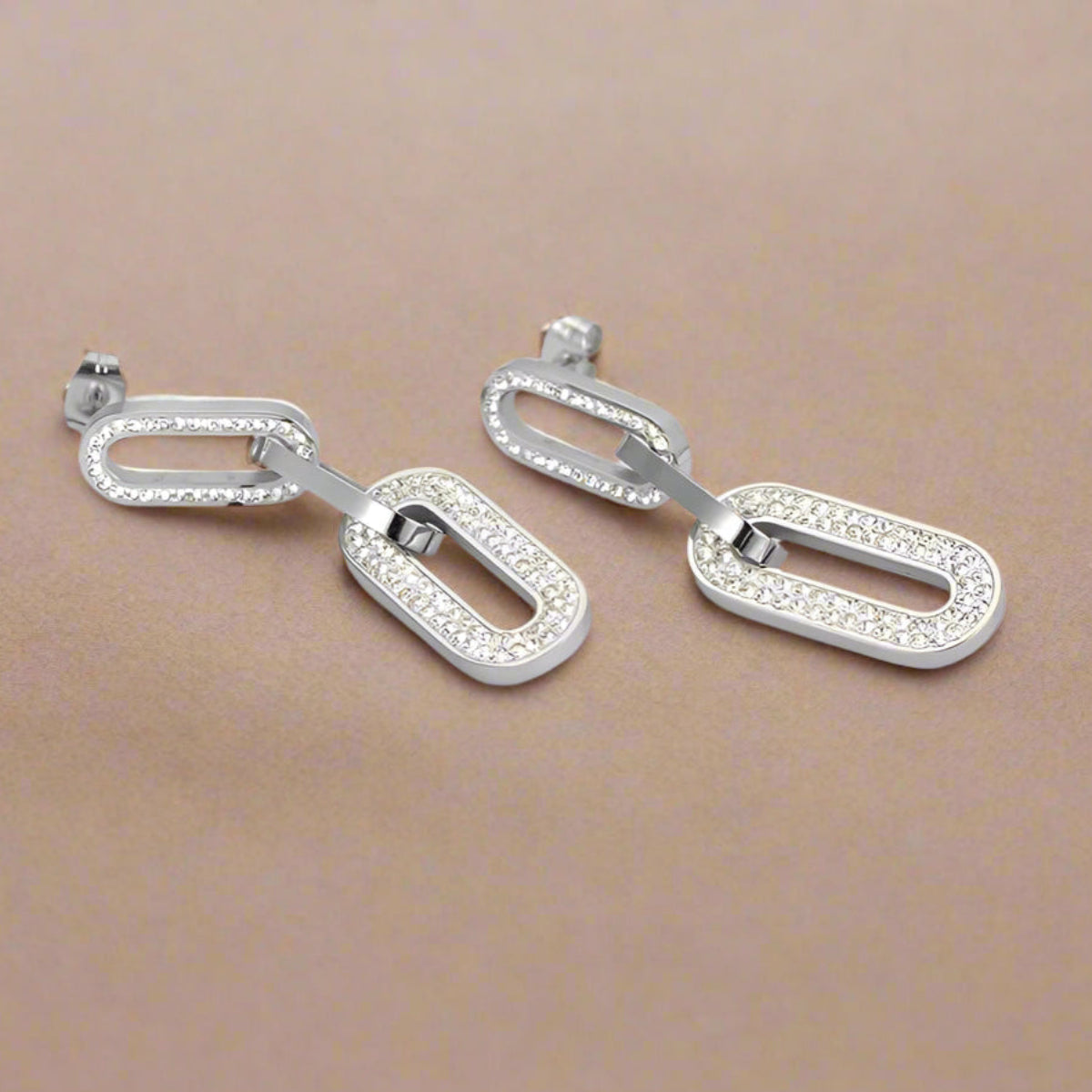 Glamorous gold chain earrings displayed on product card