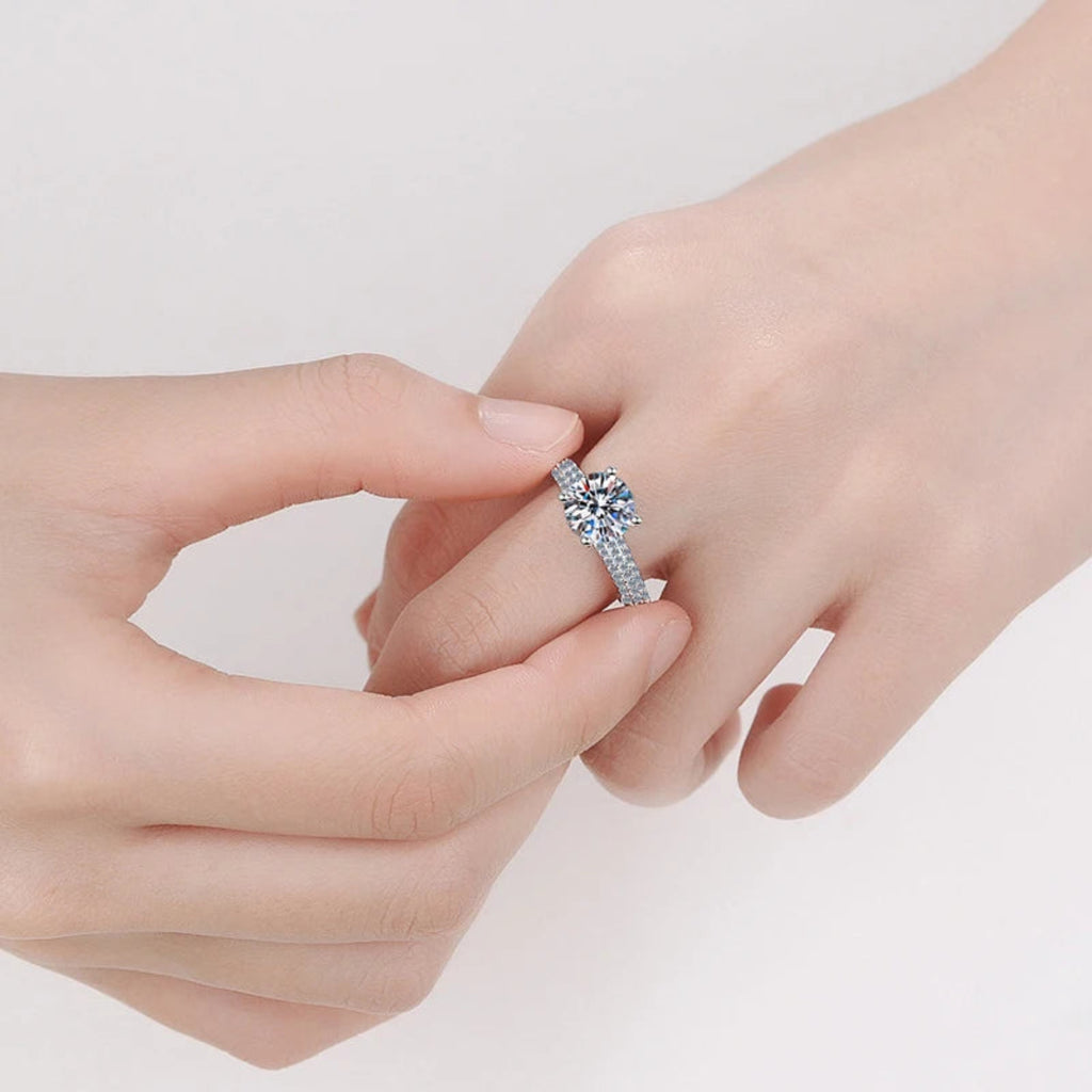 Close-up of silver ring with a sparkling gem.