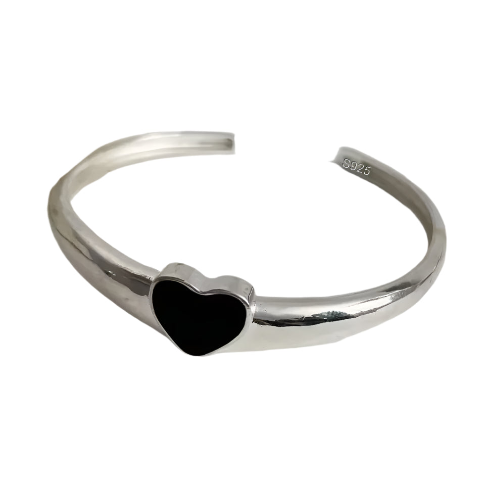 Sterling silver heart cuff bracelet shown from top view on wrist