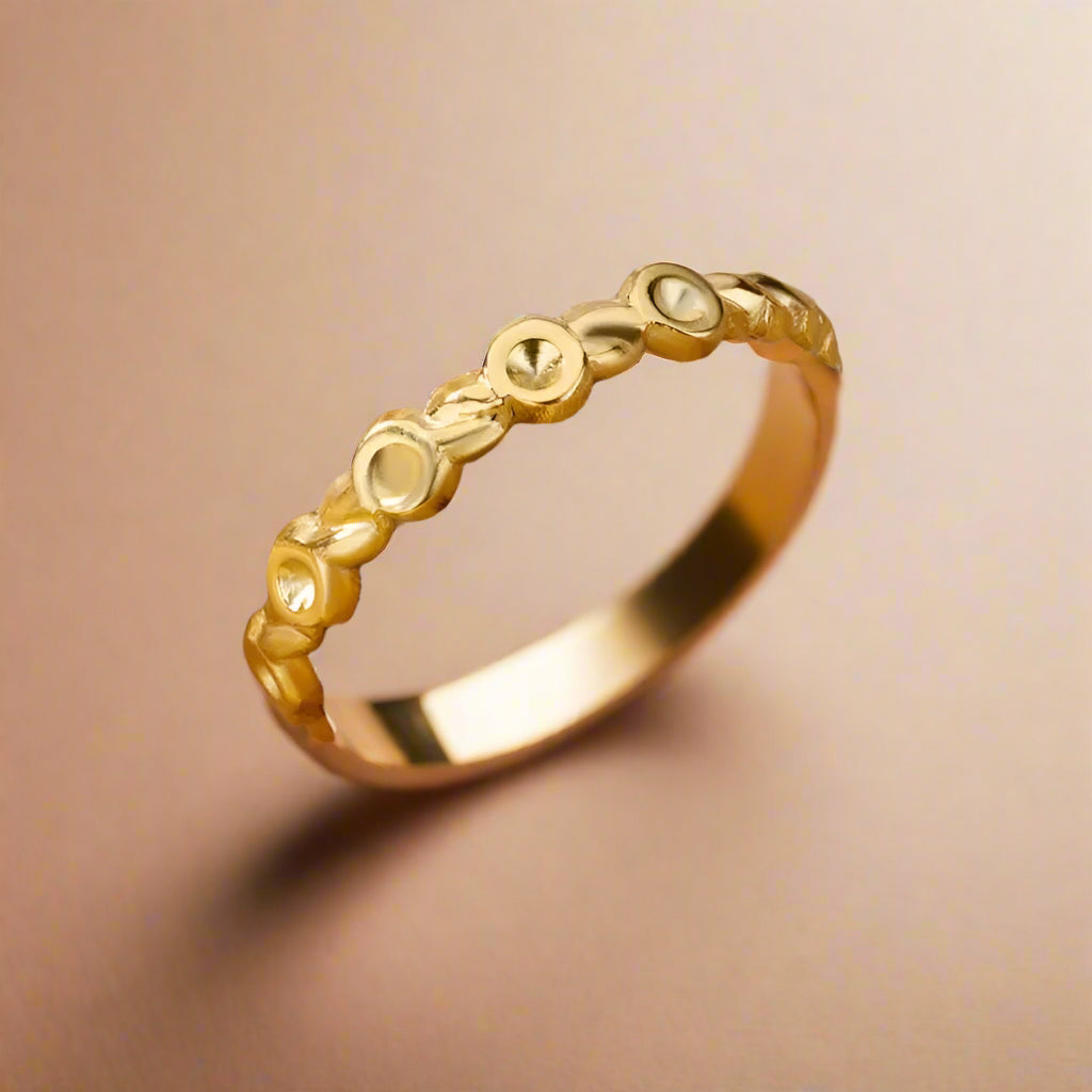 Elegant minimalist gold open ring displayed flat.