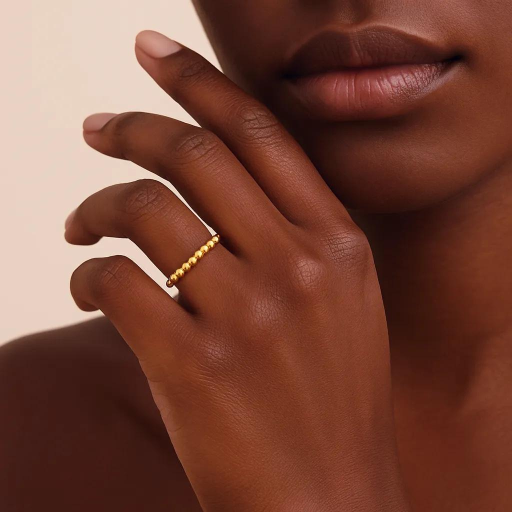 Side view of gold-plated, beaded open ring.