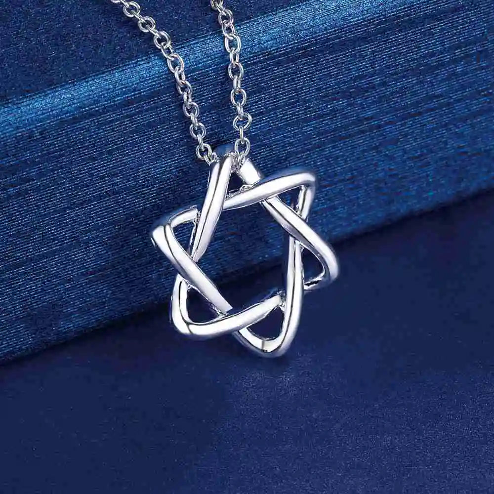  Close-up of intertwined silver loops forming a star
