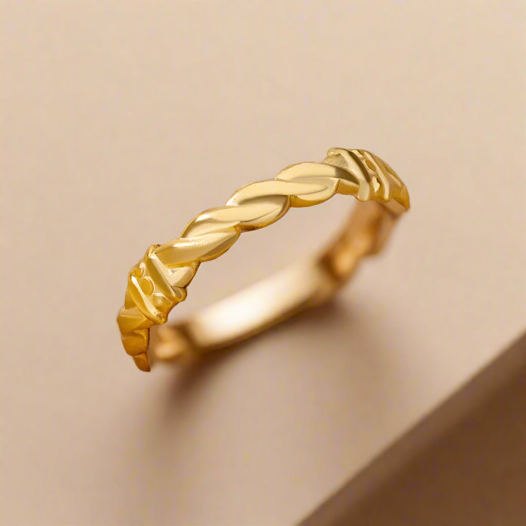 Minimalist gold ring showcasing timeless style.
