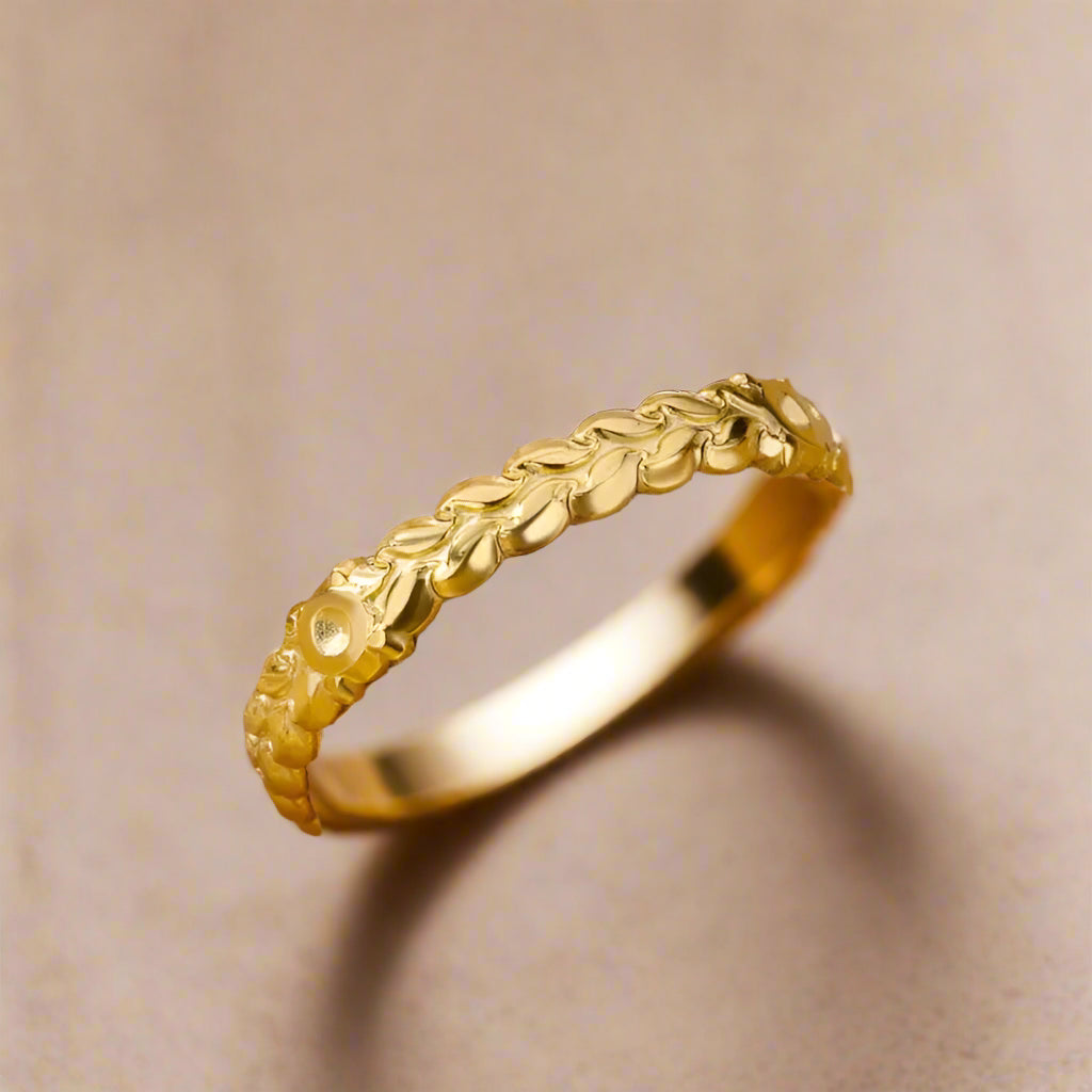 Adjustable open band gold ring detail.