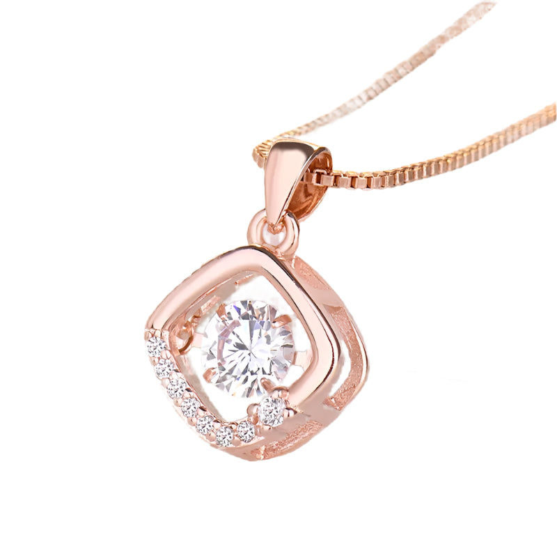 Rose gold pendant with central cubic zirconia.