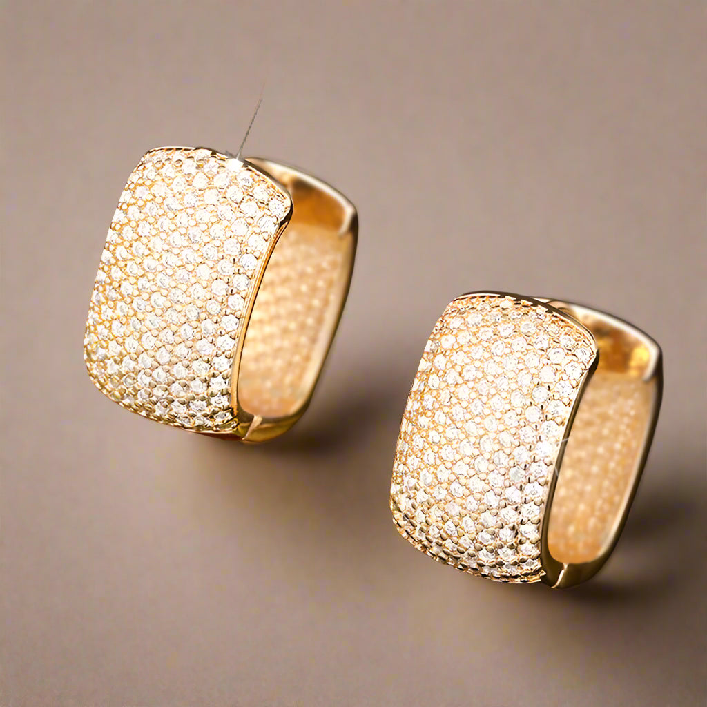 Gold-tone U-shaped earrings with brilliant CZ stone