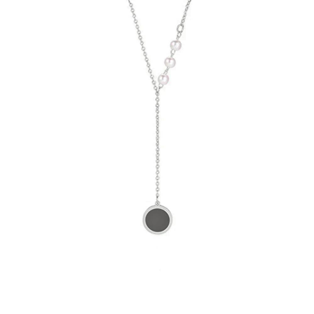Silver minimalist necklace with pearl accents and black circle pendant