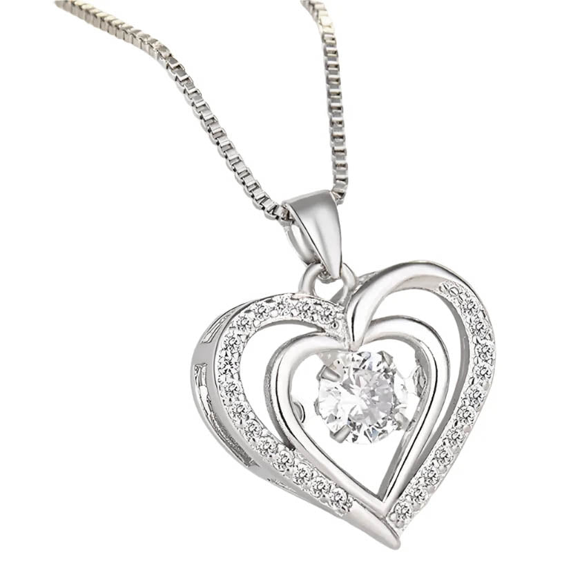 Close-up of silver heart pendant with crystal.