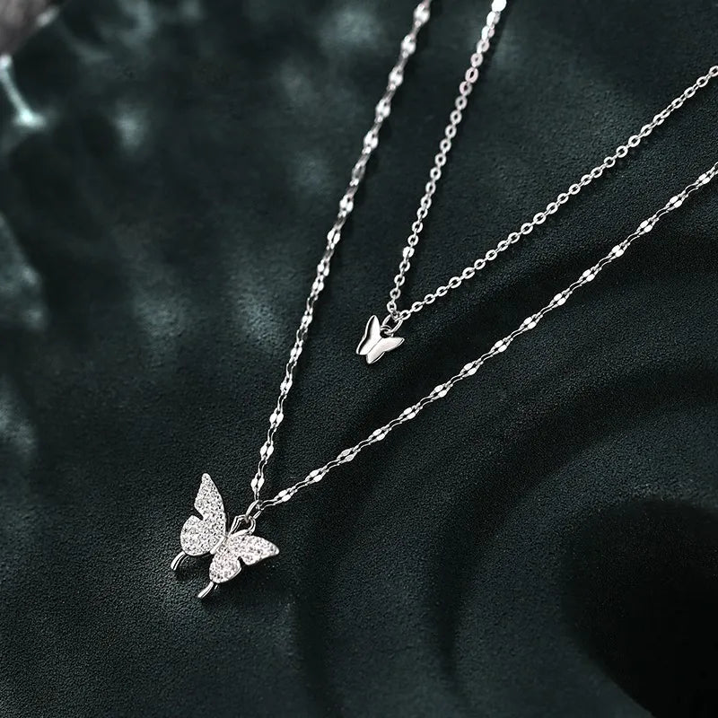 Elegant silver necklace displayed on dark fabric