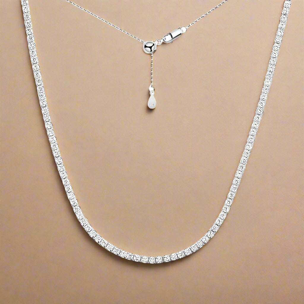 Model wearing silver version of the Solvéa moissanite necklace