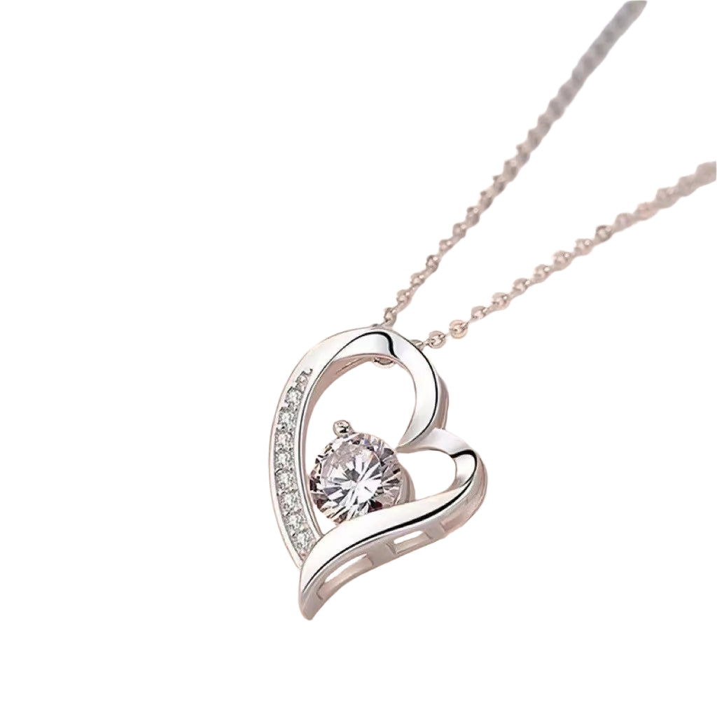 Silver heart-shaped necklace with a clear gemstone on a light background