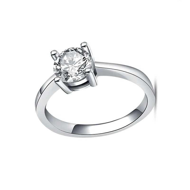 Silver ring with a diamond on a white background