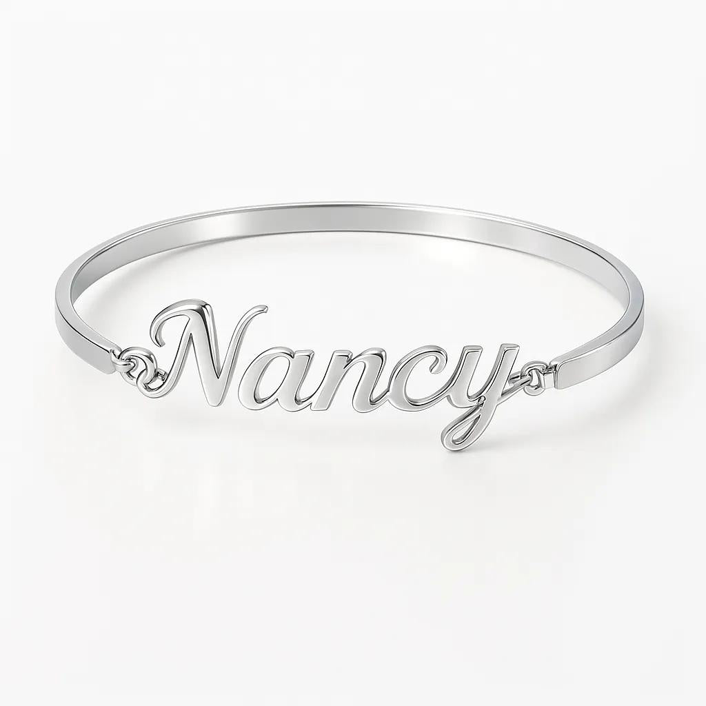 Silver bracelet with 'Nancy' engraved on a white background