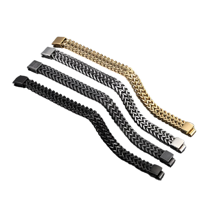 Three braided metal bracelets in black, silver, and gold on a white background