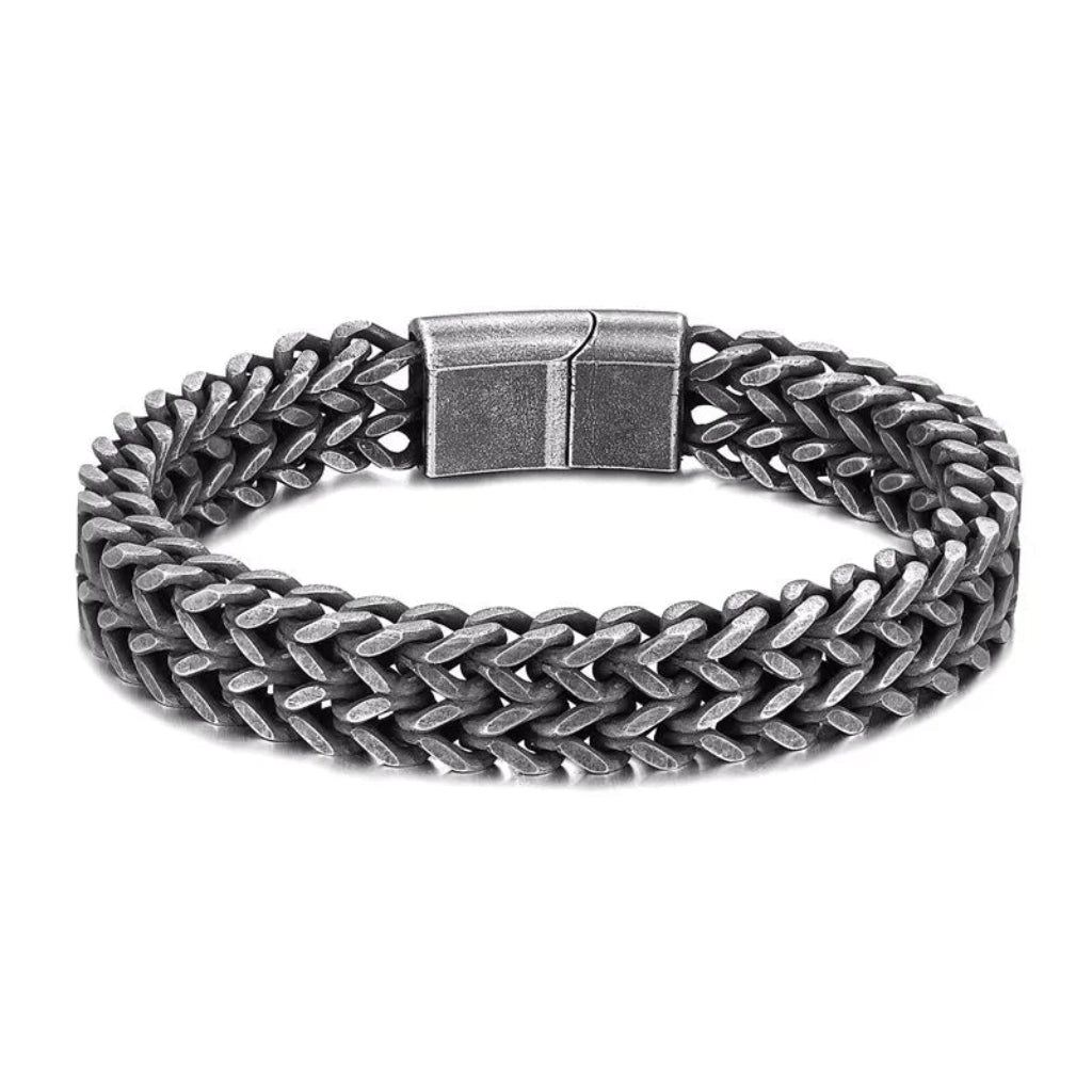 Silver chain bracelet with a clasp on a white background
