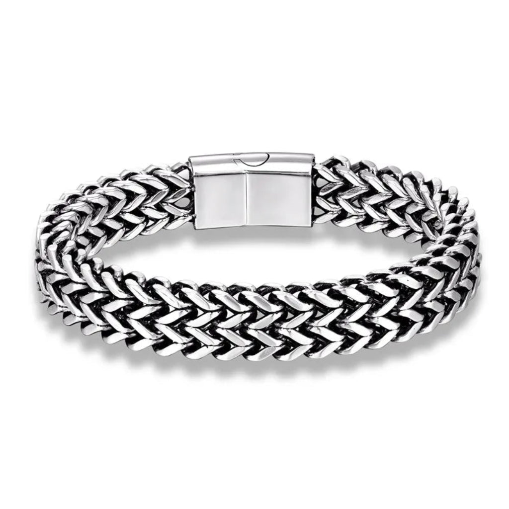 Silver braided bracelet with a clasp on a white background