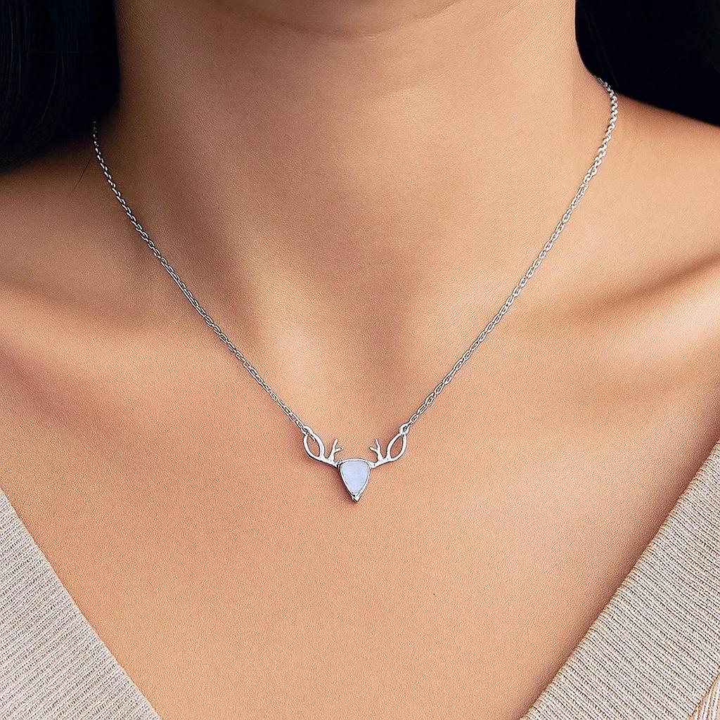 Minimalist necklace featuring antler design with opalite stone  