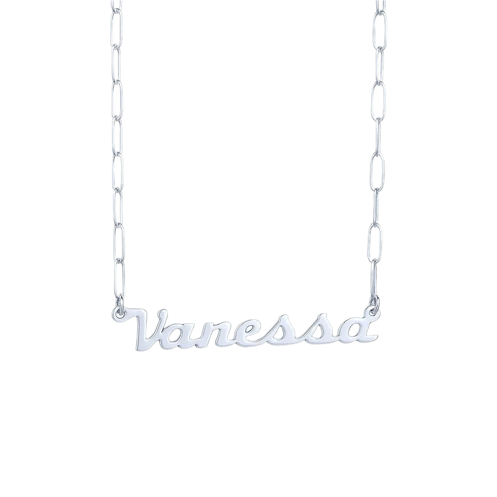 Close-up of silver name necklace on black surface.