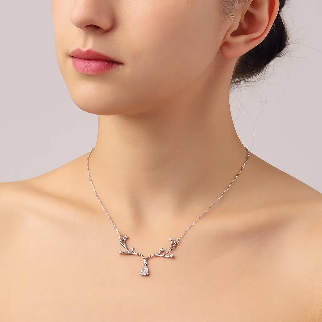 Sterling silver necklace with intricate crystal details.