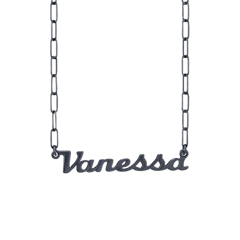 Close-up of  black silver name necklace on black surface.