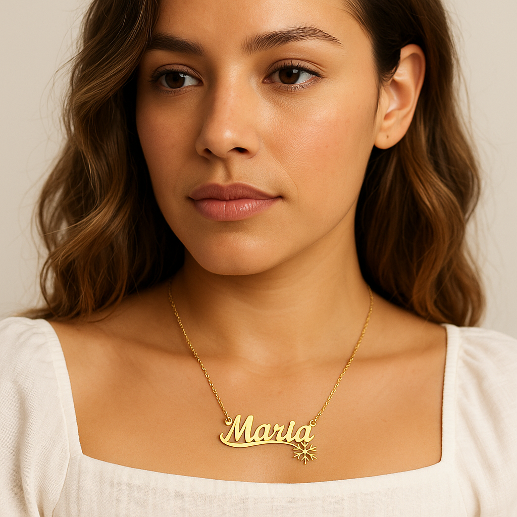 Close-up of gold necklace with personalized name. 