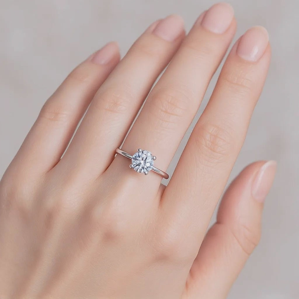 Minimalist moissanite solitaire ring displayed in gift packaging